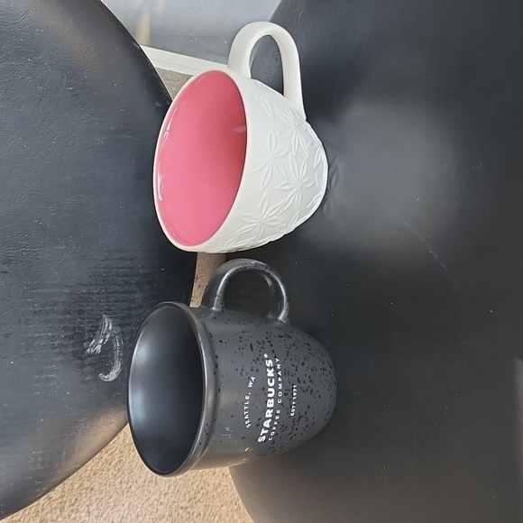 2 starbucks mugs used